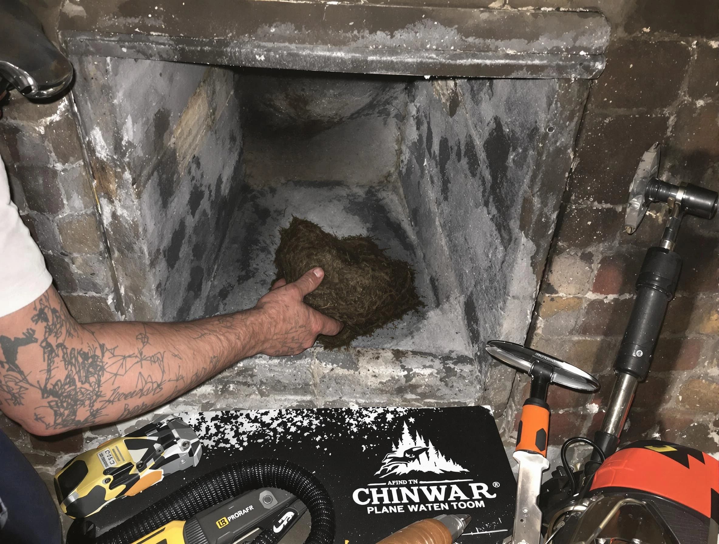 Cambridge Chimney Sweep safely removing debris and screening chimney in Cambridge, MA